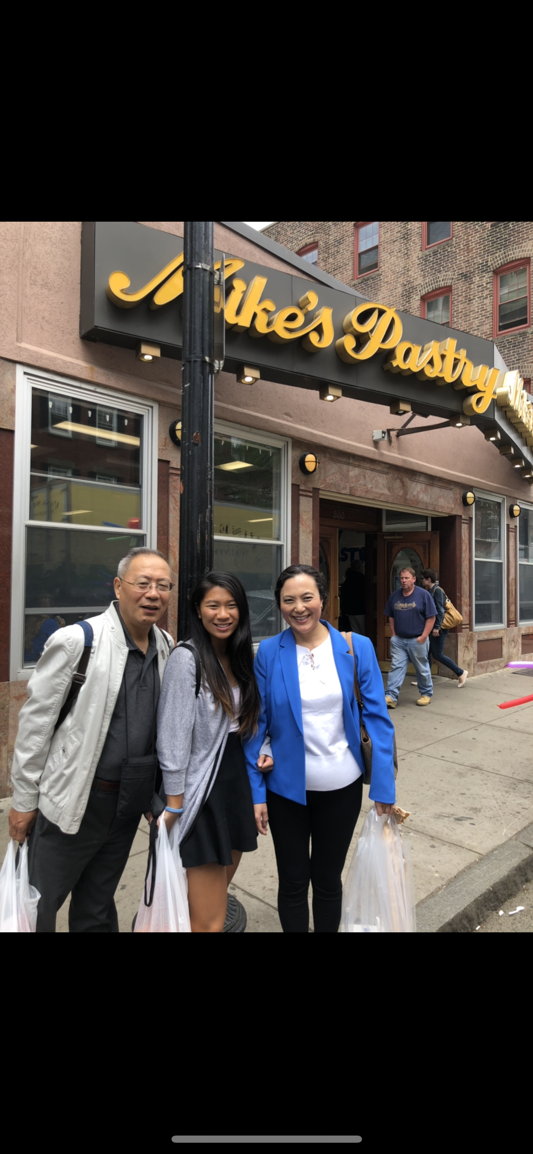family in front of a restaurant