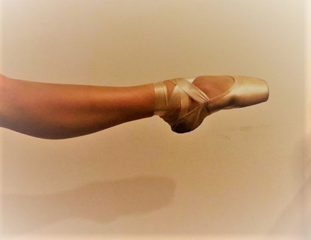 female dancer wearing pointe shoe