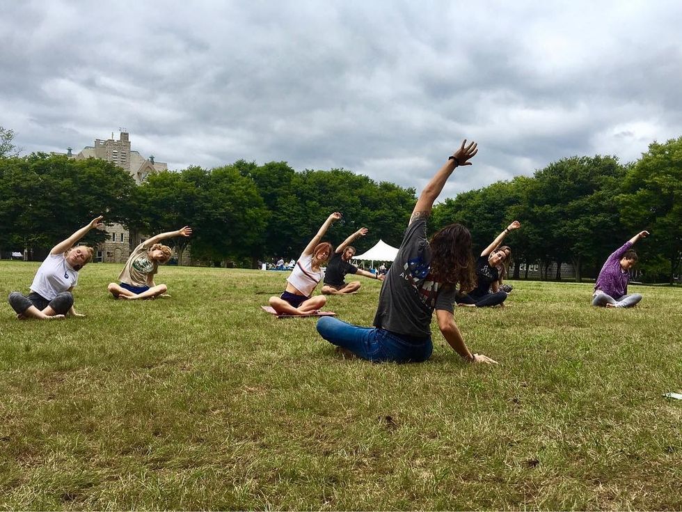 friends laughing and walking through abandoned lot together