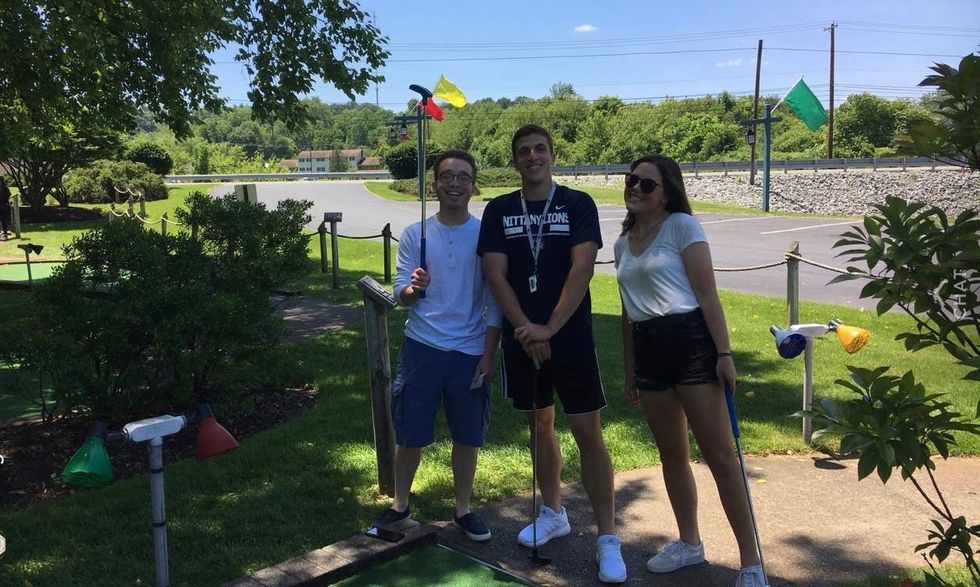 friends playing golf