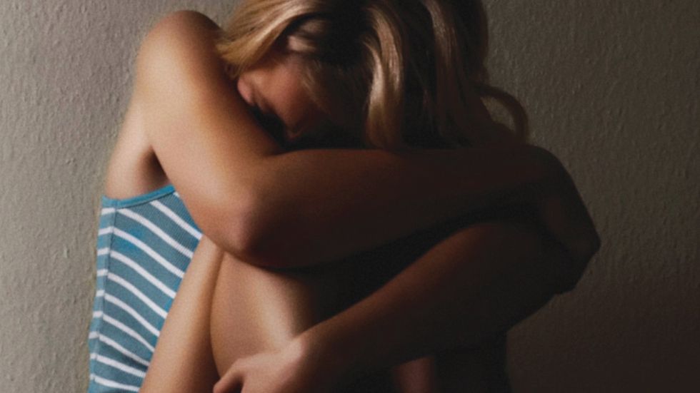 frustrated woman sitting in bath tub