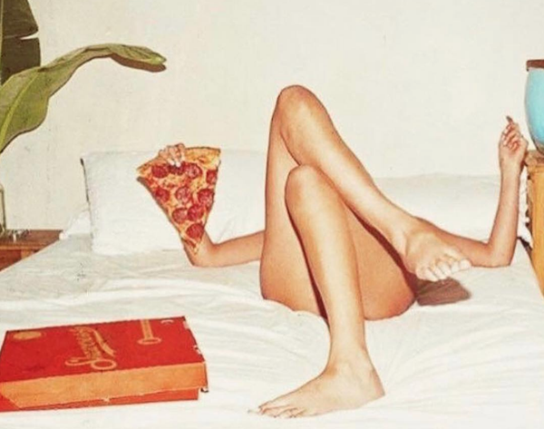 girl eating pizza