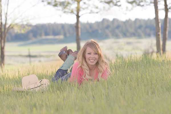 girl in boots with a cowboy hat