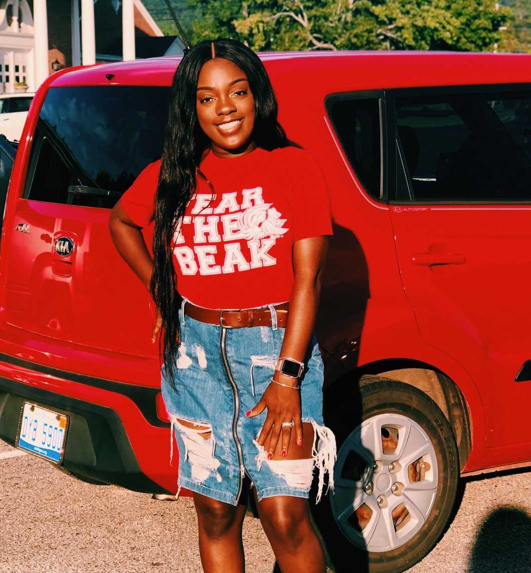 girl in front of car