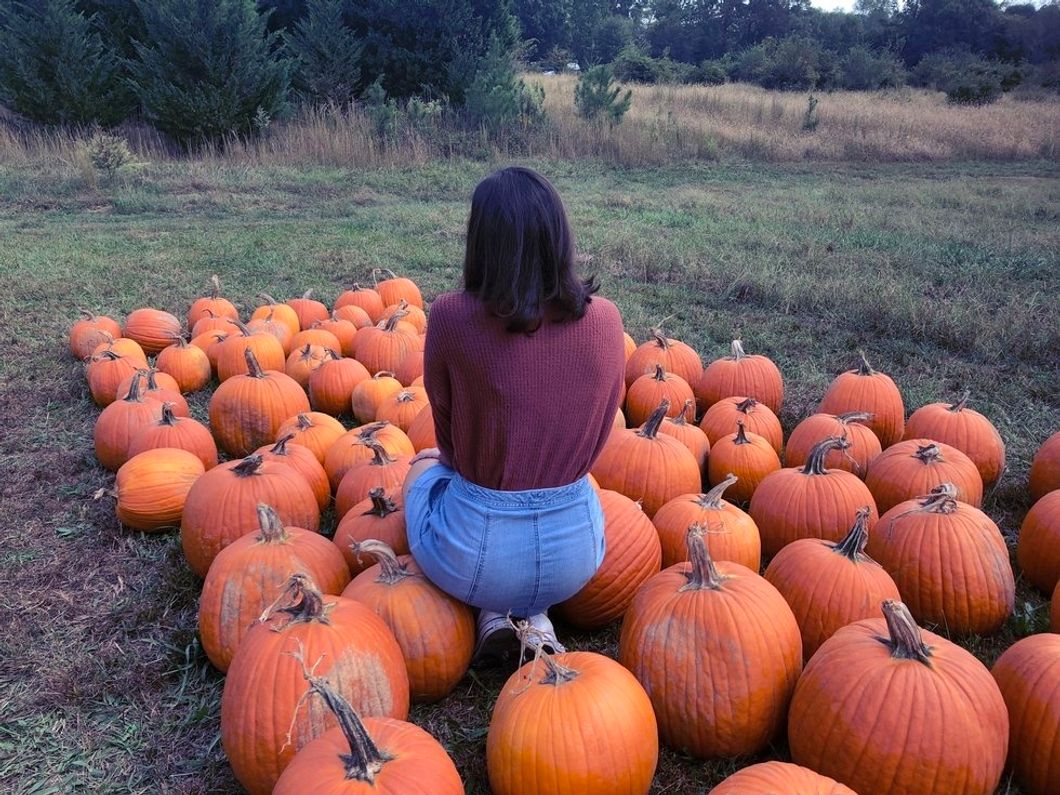 girl in pumpkins