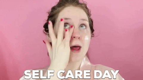 Girl putting lotion on her face