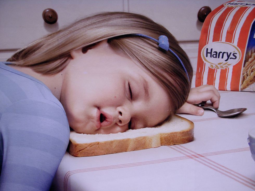 girl sleeping on bread