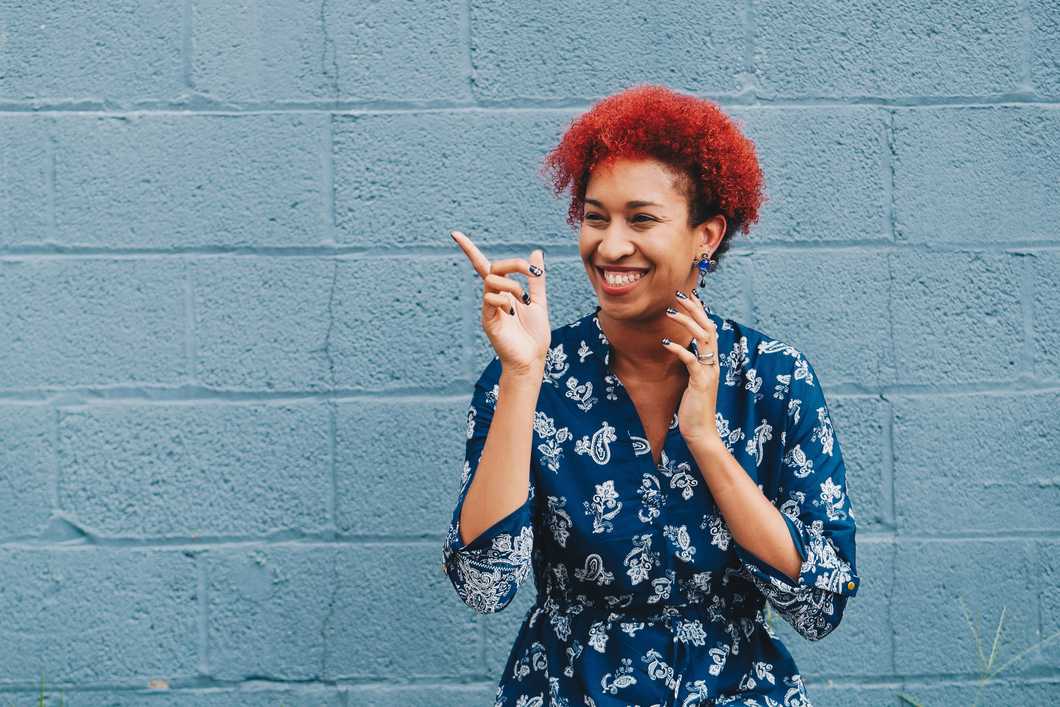 Girl smiling and pointing