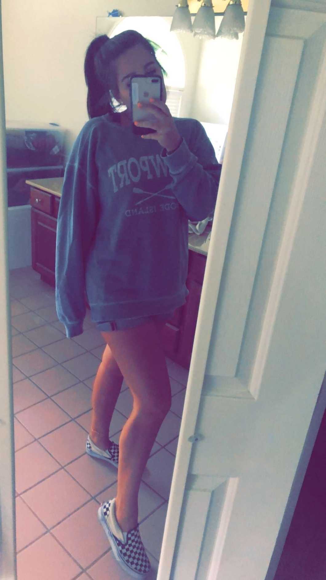 girl taking selfie in mirror