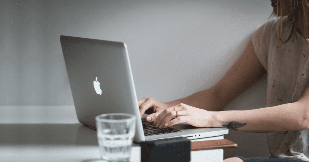 Girl typing on laptop