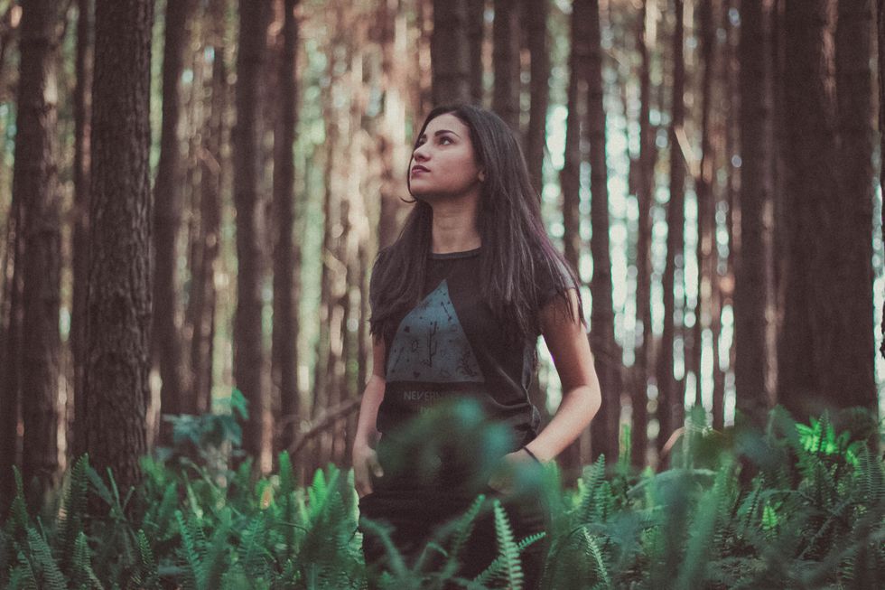 girl walking alone in field
