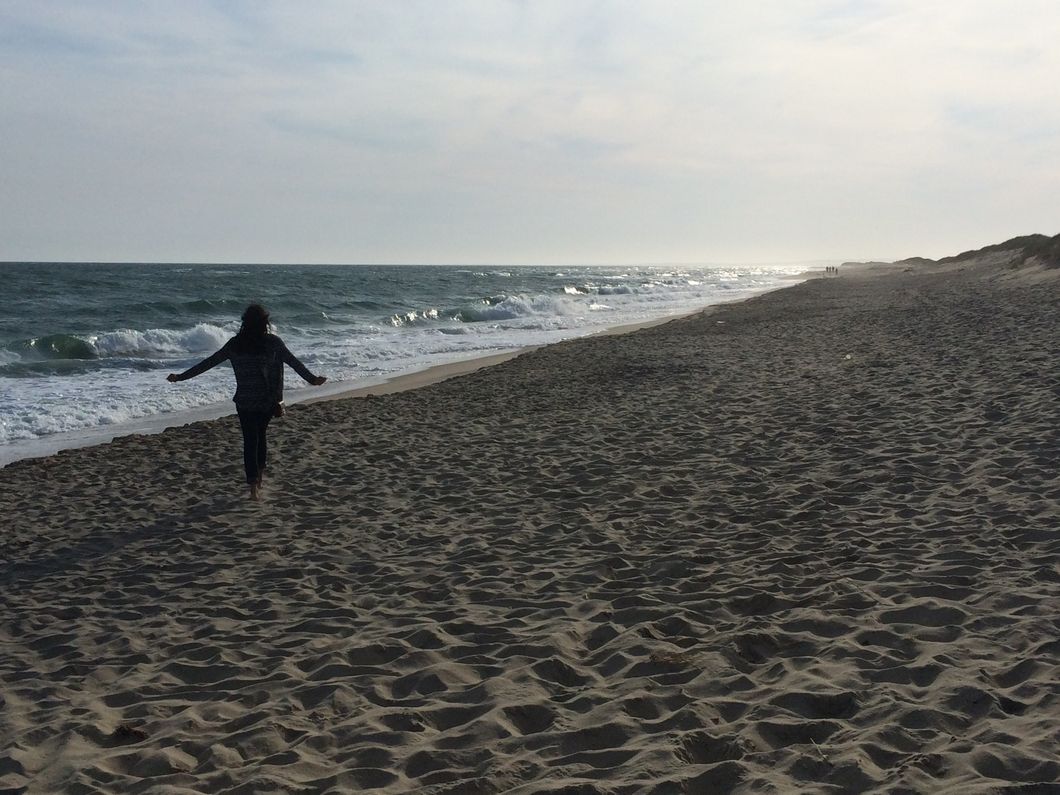 Girl walking on the beach