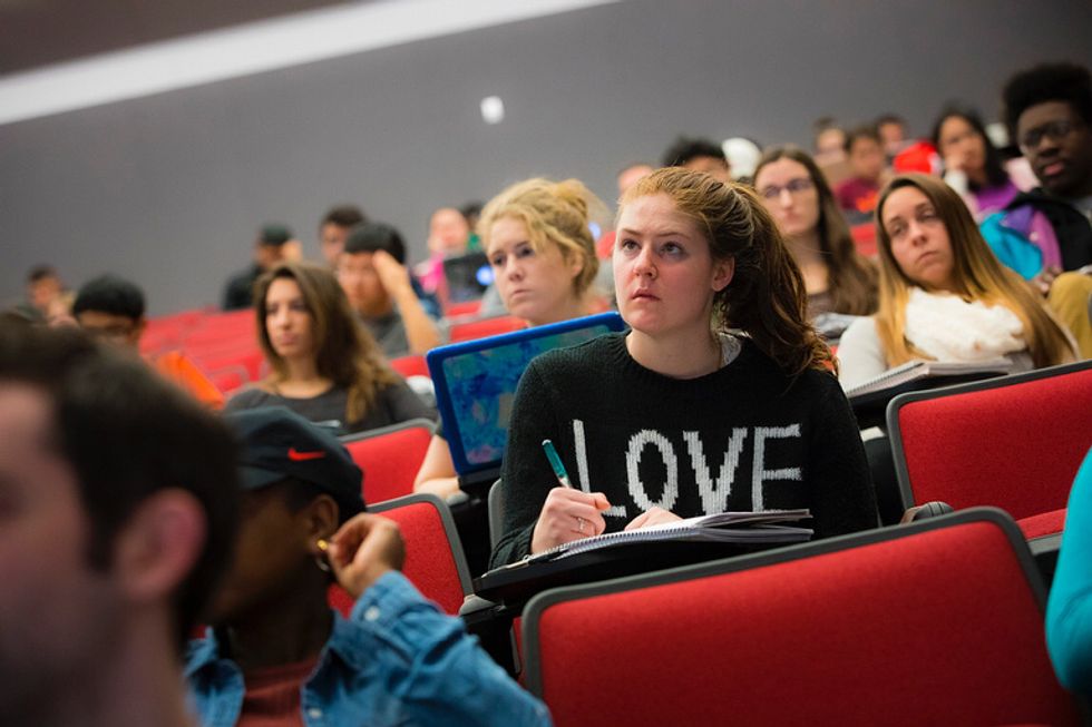 Girl wearing graduation cap and gown