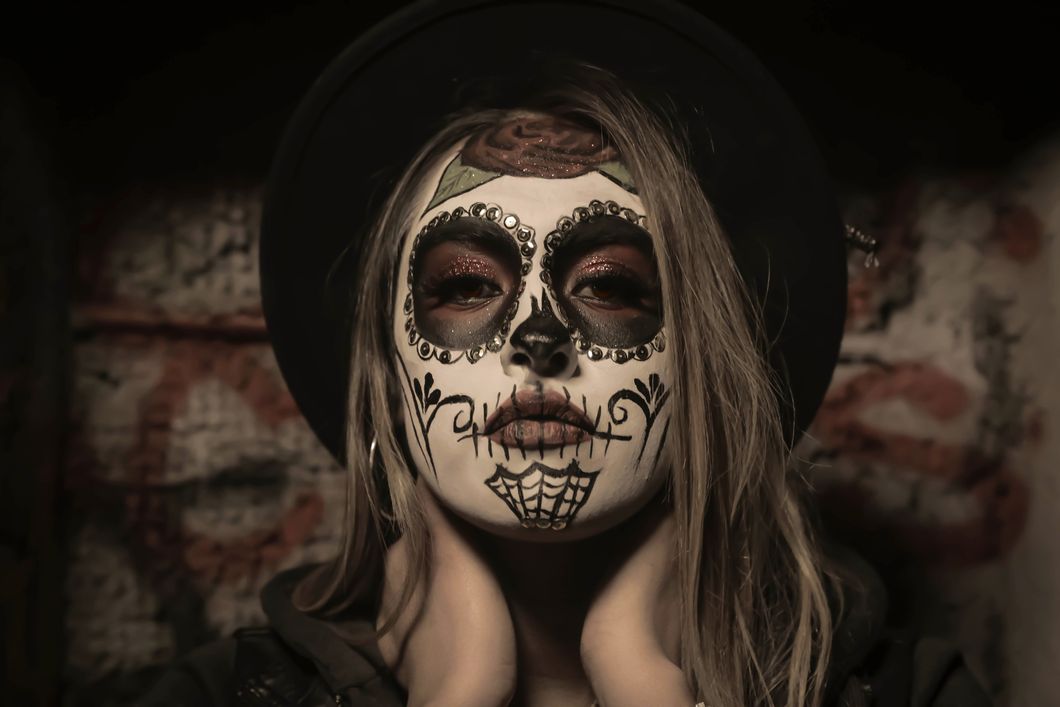 Girl wearing skull face paint