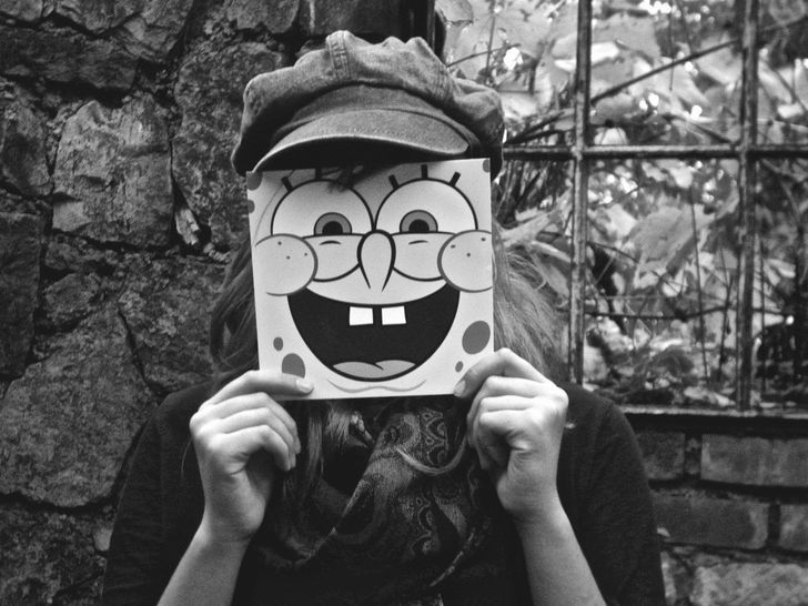 girl wearing spongebob mask