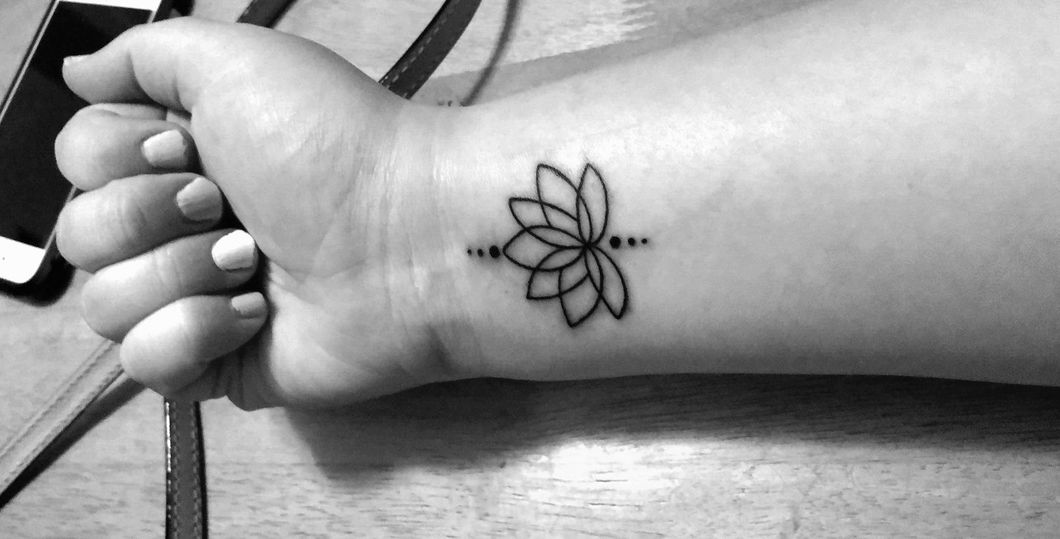 Girl with a tattoo on her arm