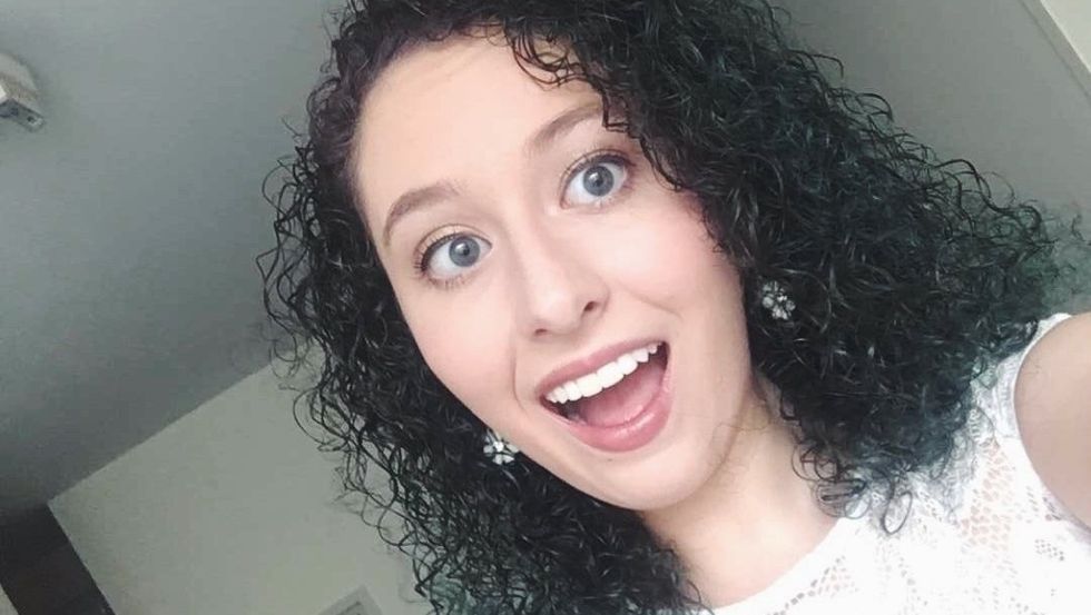 girl with curly black hair