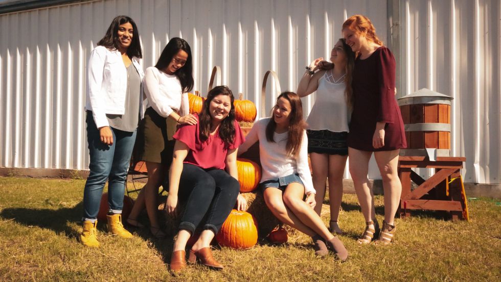 girls at a pumpkin patch