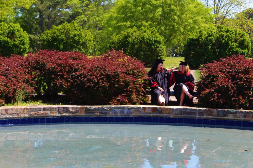 girls in graduation gowns