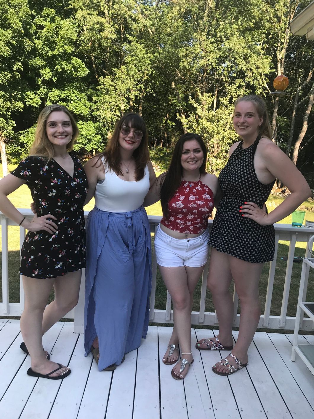 girls taking photo together outside