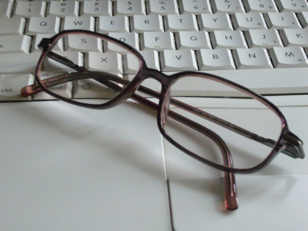 glasses on keyboard