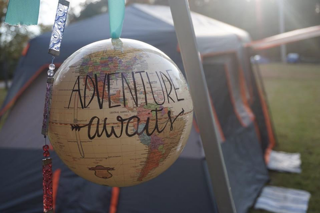 globe with adventure awaits written on its surface