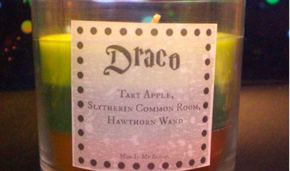 green candle with "draco" written on label