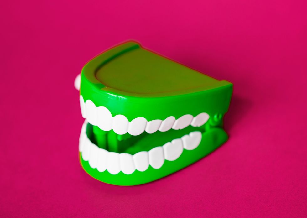 green fake teeth