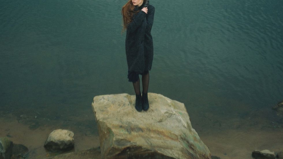 Guy sitting near a window
