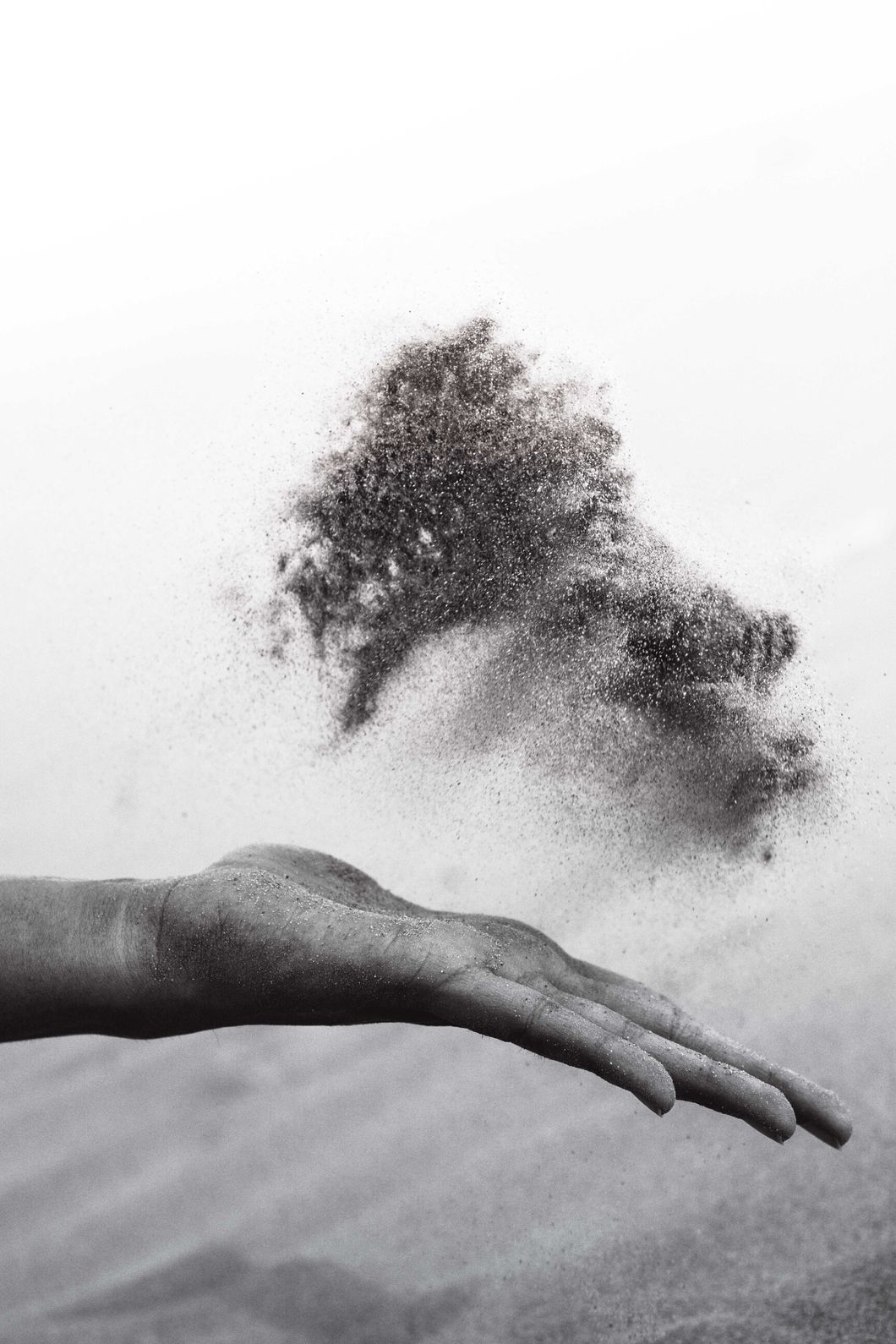 hand throwing dust