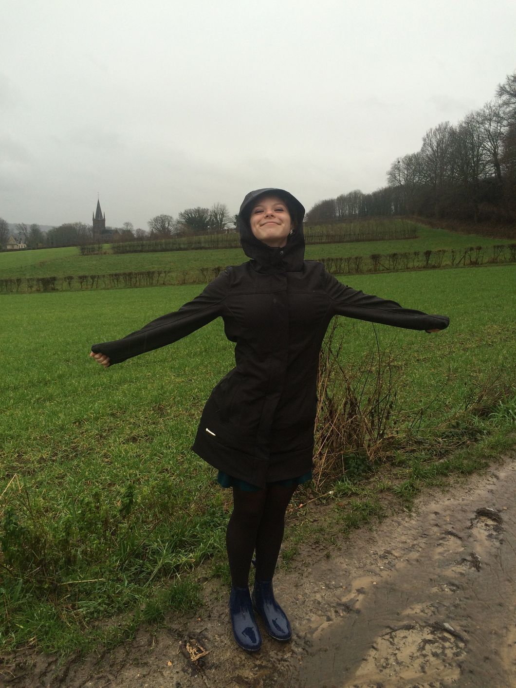 happy woman wearing raincoat