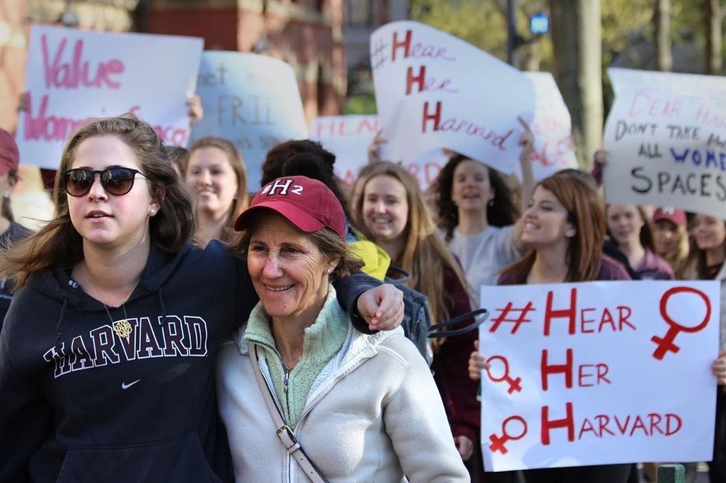 harvard student women protesting stand up to harvard