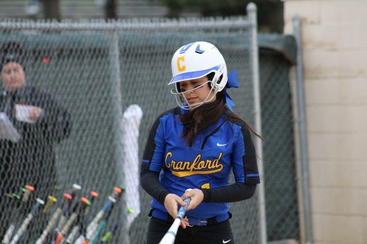 high school girl playing softball