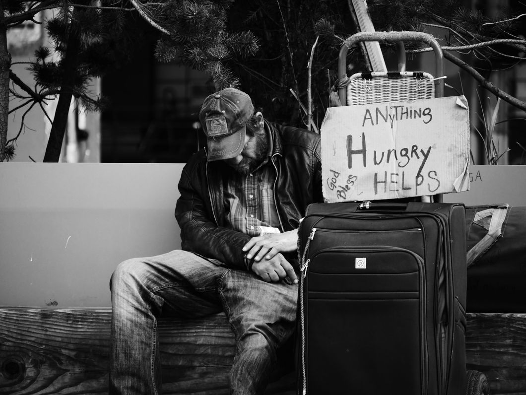 Homeless man and a sign