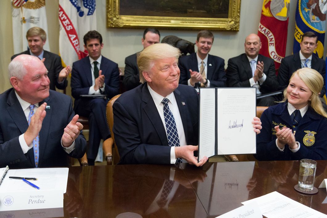 https://commons.wikimedia.org/wiki/File:Donald_Trump_displays_the_signed_Executive_Order_promoting_Agriculture_and_Rural_Prosperity.jpg