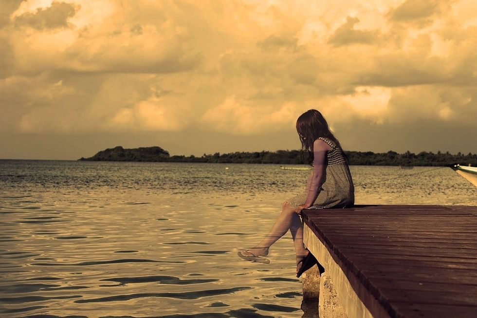 https://pixabay.com/en/lonely-girl-lake-sepia-alone-dock-3862214/