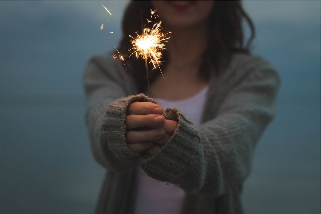 https://pixabay.com/en/sparkler-holding-hands-firework-677774/