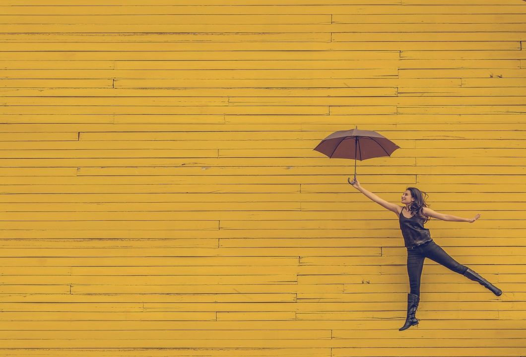 https://pixabay.com/en/woman-umbrella-floating-jumping-1245817/