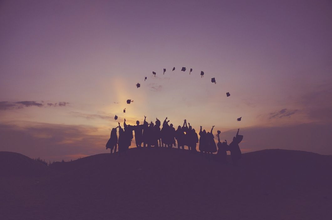 https://pixabay.com/photos/dawn-graduates-throwing-hats-dusk-1840298/