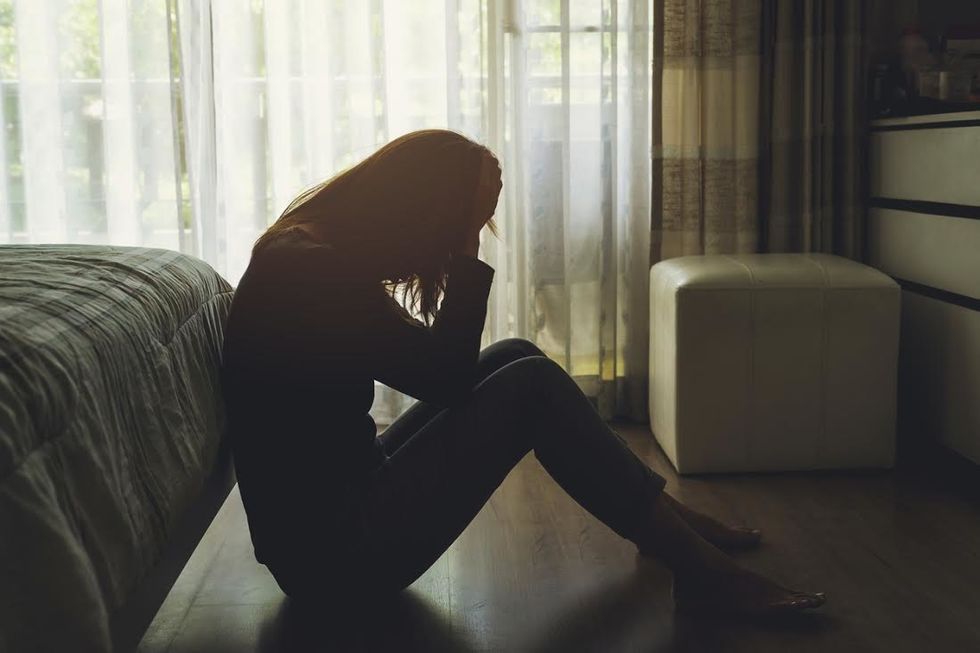 https://www.istockphoto.com/photo/depressed-woman-sitting-in-the-dark-bedroom-gm680834894-124805403