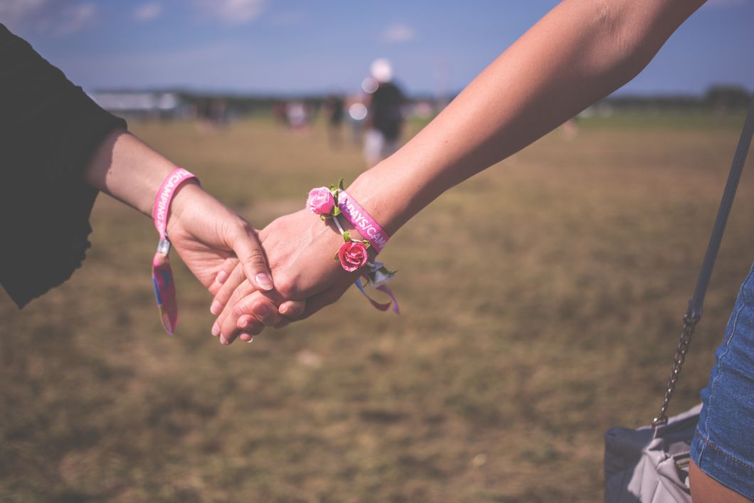 https://www.pexels.com/photo/2-person-holding-each-other-wearing-pink-friendship-bracelet-during-daytime-118033/