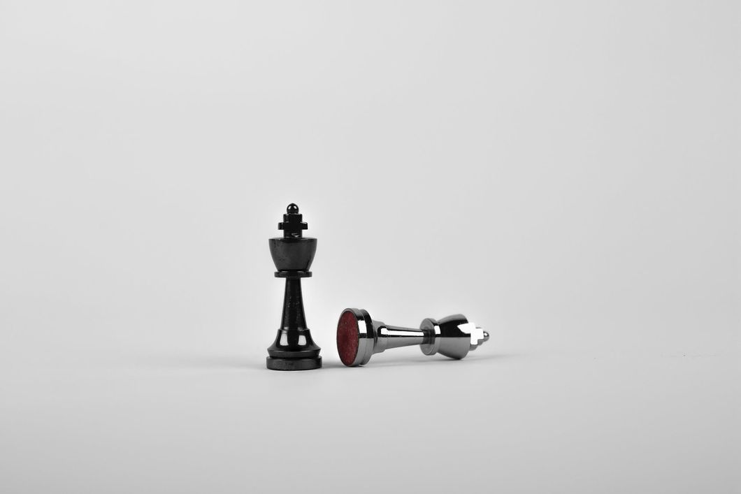 https://www.pexels.com/photo/battle-black-board-game-chess-411207/