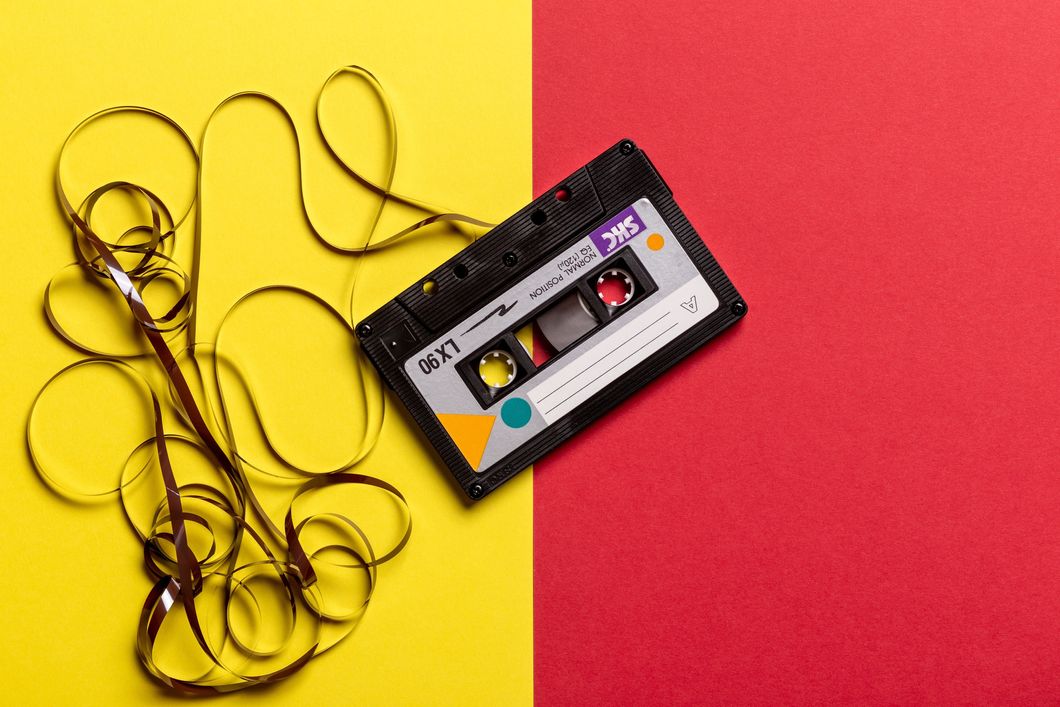 https://www.pexels.com/photo/black-cassette-tape-on-top-of-red-and-yellow-surface-1626481/