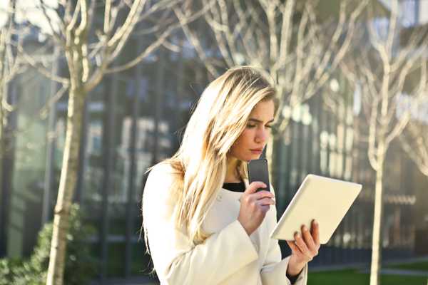 https://www.pexels.com/photo/brown-haired-woman-holding-a-white-wireless-device-789703/
