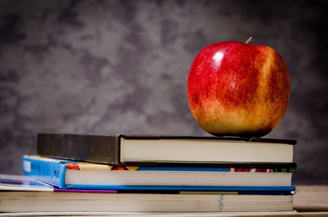 https://www.pexels.com/photo/close-up-of-apple-on-top-of-books-256520/
