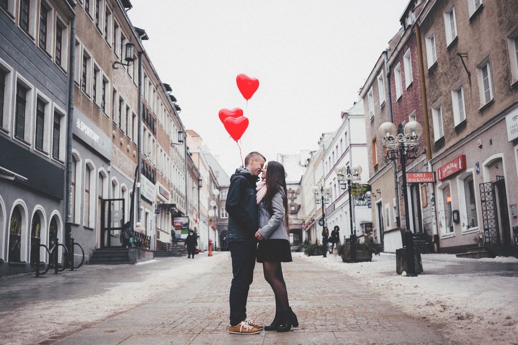 https://www.pexels.com/photo/couple-walking-on-city-street-307791/