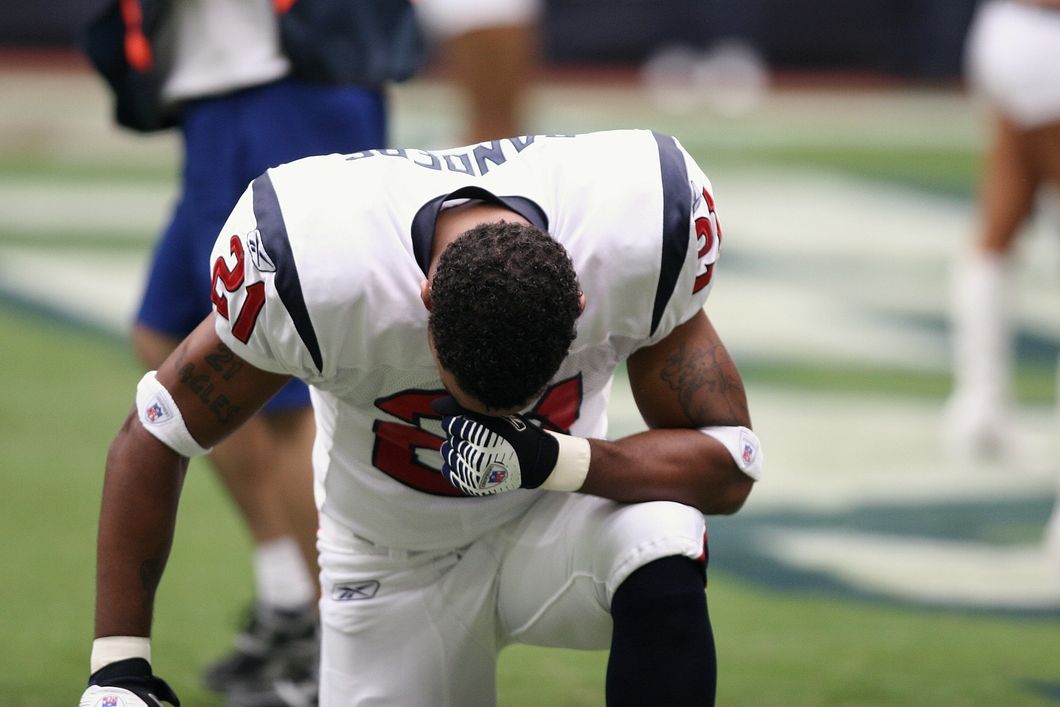 https://www.pexels.com/photo/football-player-on-bended-knees-160577/