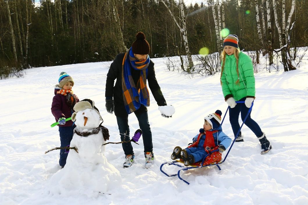 https://www.pexels.com/photo/four-persons-playing-on-snow-1620932/