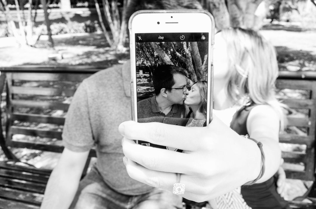 https://www.pexels.com/photo/gray-scale-photo-of-man-and-woman-taking-a-selfie-675295/