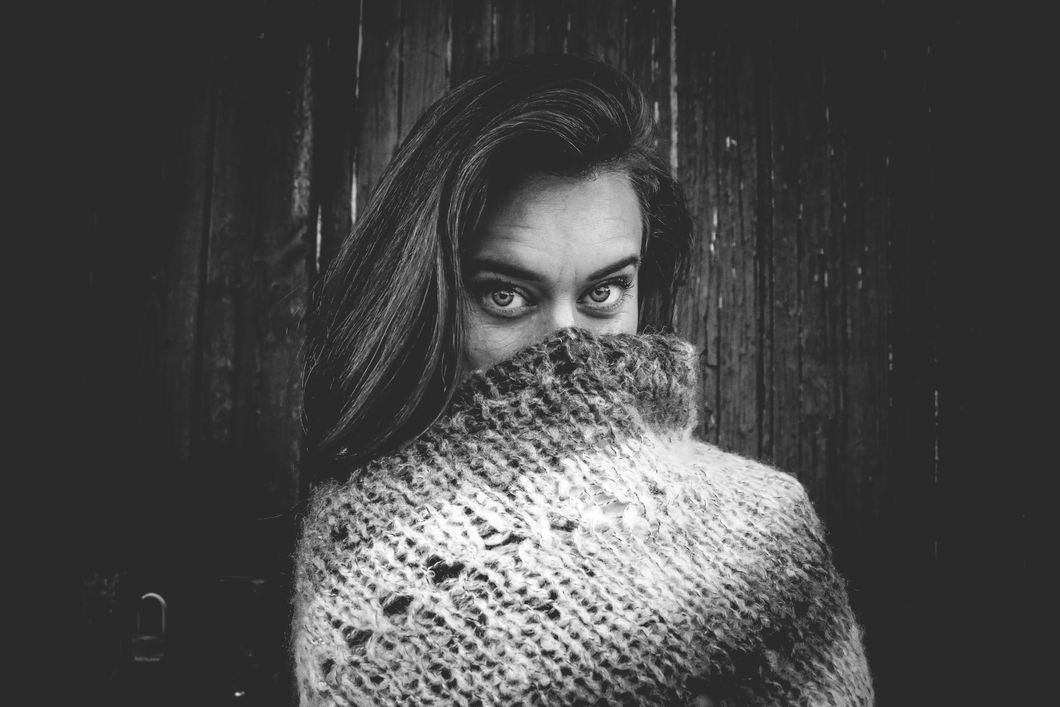 https://www.pexels.com/photo/grayscale-photo-of-woman-covering-mouth-with-knitted-textile-746844/